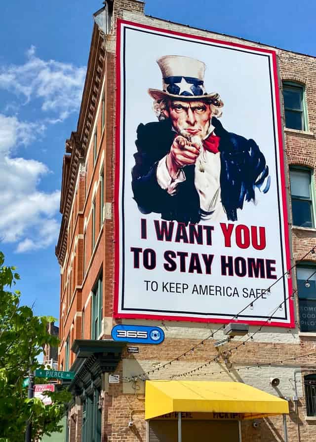 Large sign on a building. Uncle Sam image with the words'I want YOU to stay home'