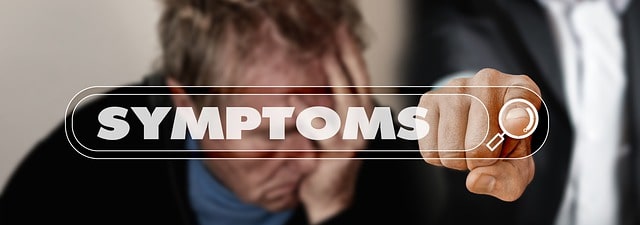 image of a person hoding their head in their hand, with the word symptoms superimposed. A hand is visible, touching a representation of a magnifying glass signifying search